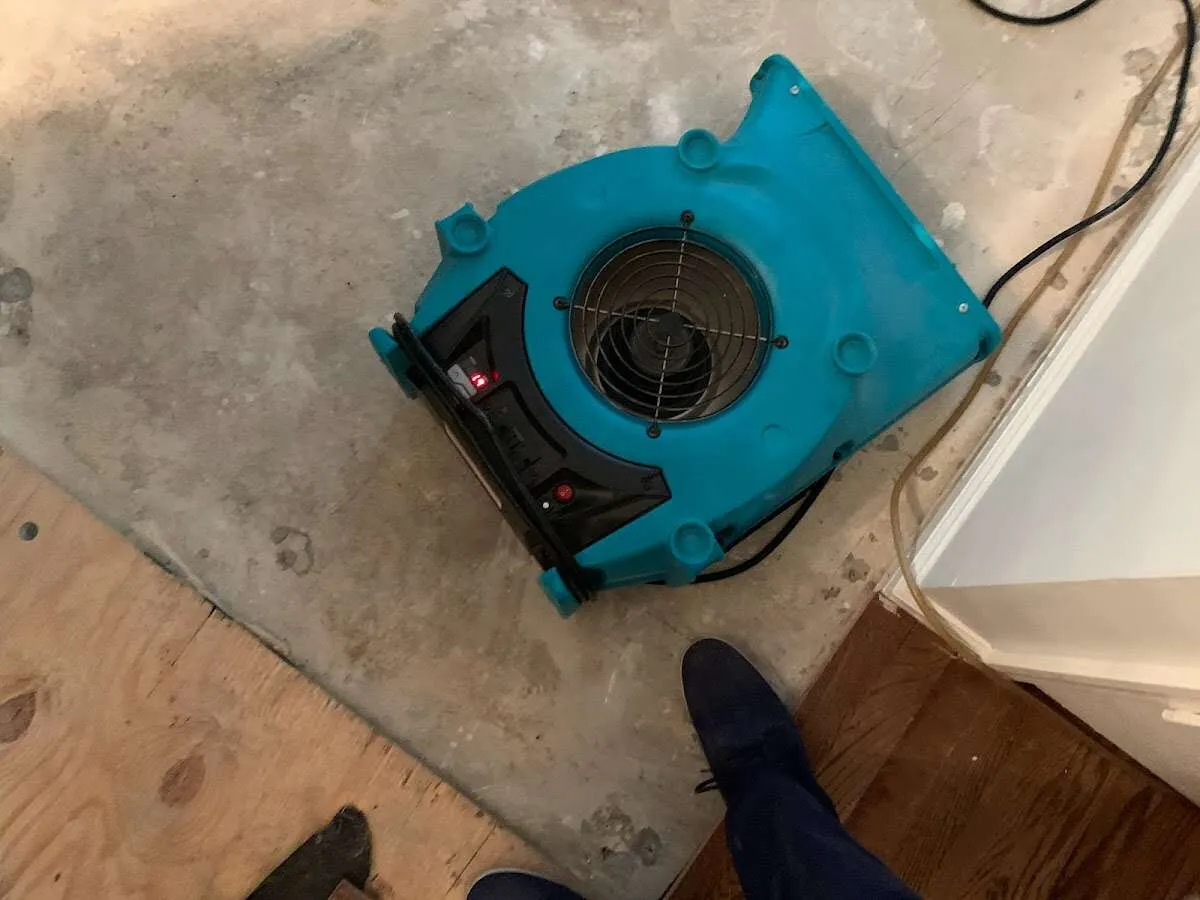 Air mover drying subfloor during Leak Detection & Repair in Casa Grande